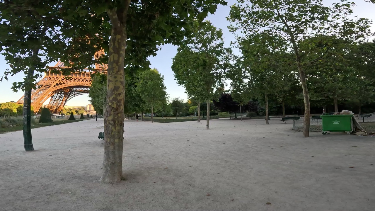 A gravel park path toward the Eiffel Tower.